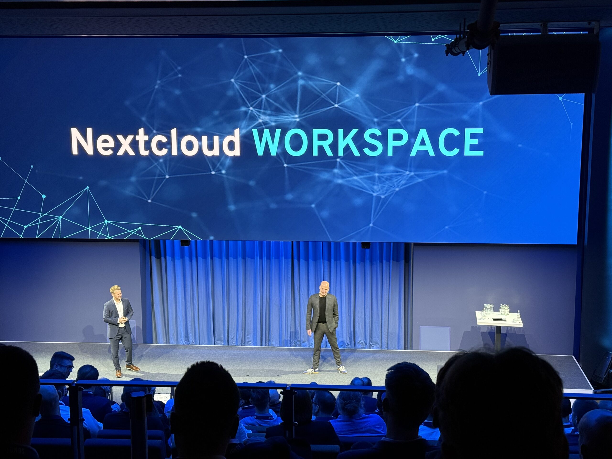 imageRoundShadow Picture taken at the IONOS x Nextcloud WORKSPACE launch showing the main speakers on stage